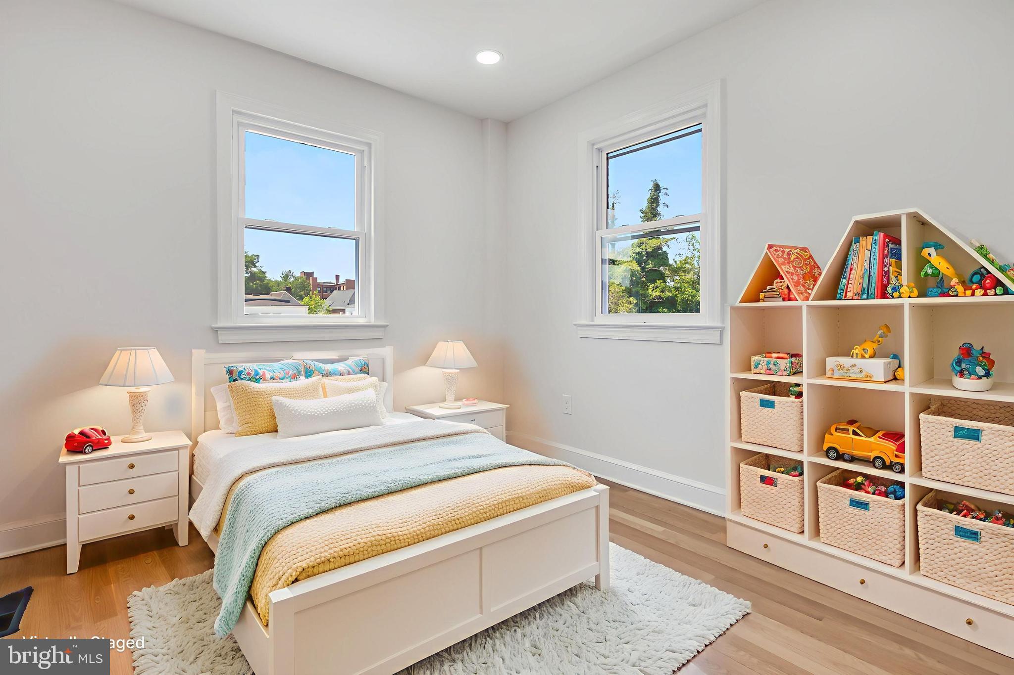 6932 8th Street Northwest Washington, DC 20012 - Photo 9 of 43 a bedroom with a bed and a book shelf
