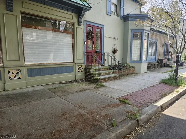 a view of a brick house with large windows