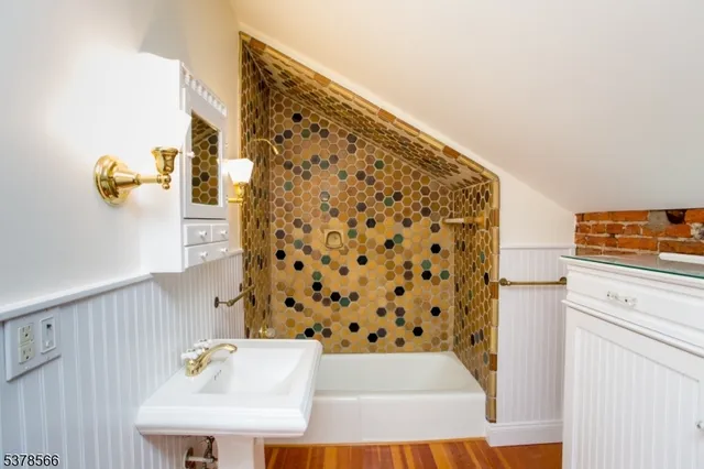 a spacious bathroom with a sink and a bathtub