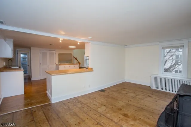 a view of livingroom with furniture and workspace