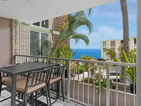 a view of a balcony with furniture