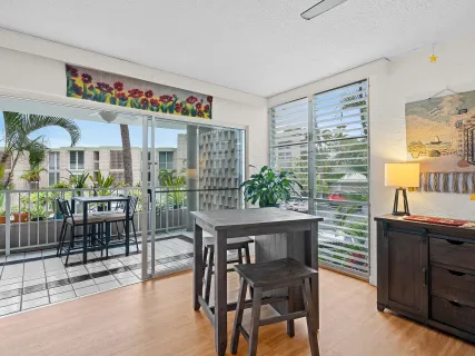 a view of a dining room with furniture window and outside view