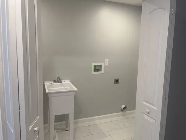 a bathroom with a sink toilet and mirror