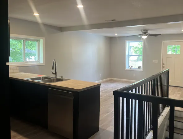 a kitchen with sink and window