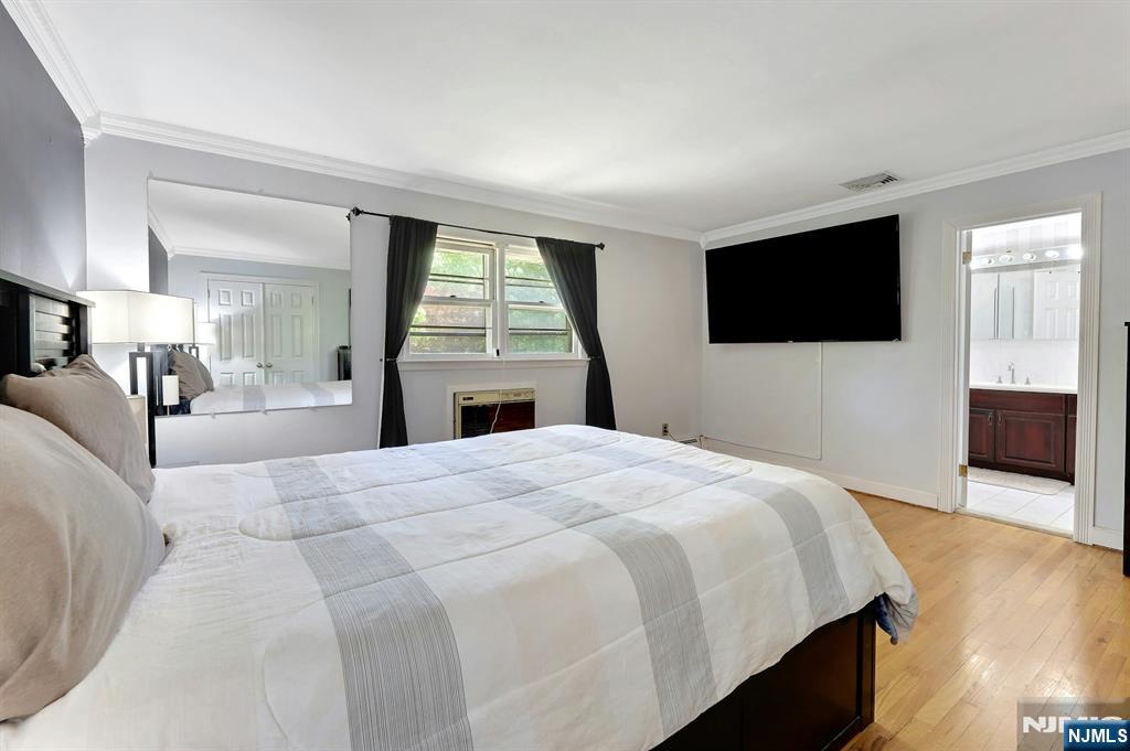 20 Blue Hill Road Norwood, NJ 07648 - Photo 21 of 49 a bedroom with a bed and a flat screen tv