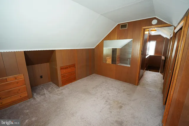 a view of an empty room and a windows