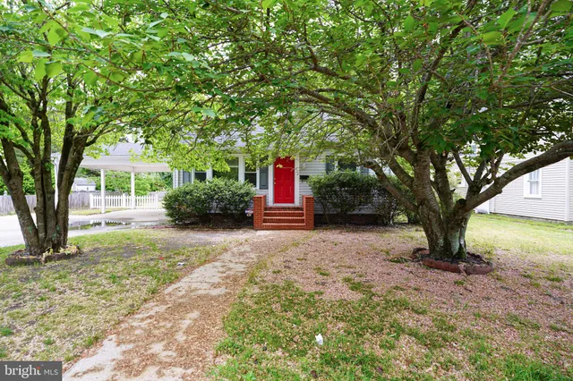 a backyard of a house with portable swimming pool and outdoor seating