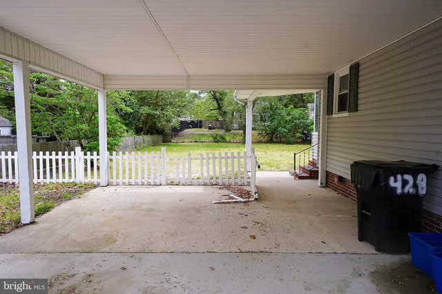 a view of a porch with backyard of the house