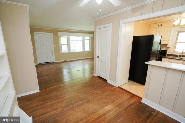 a view of a kitchen from the hallway