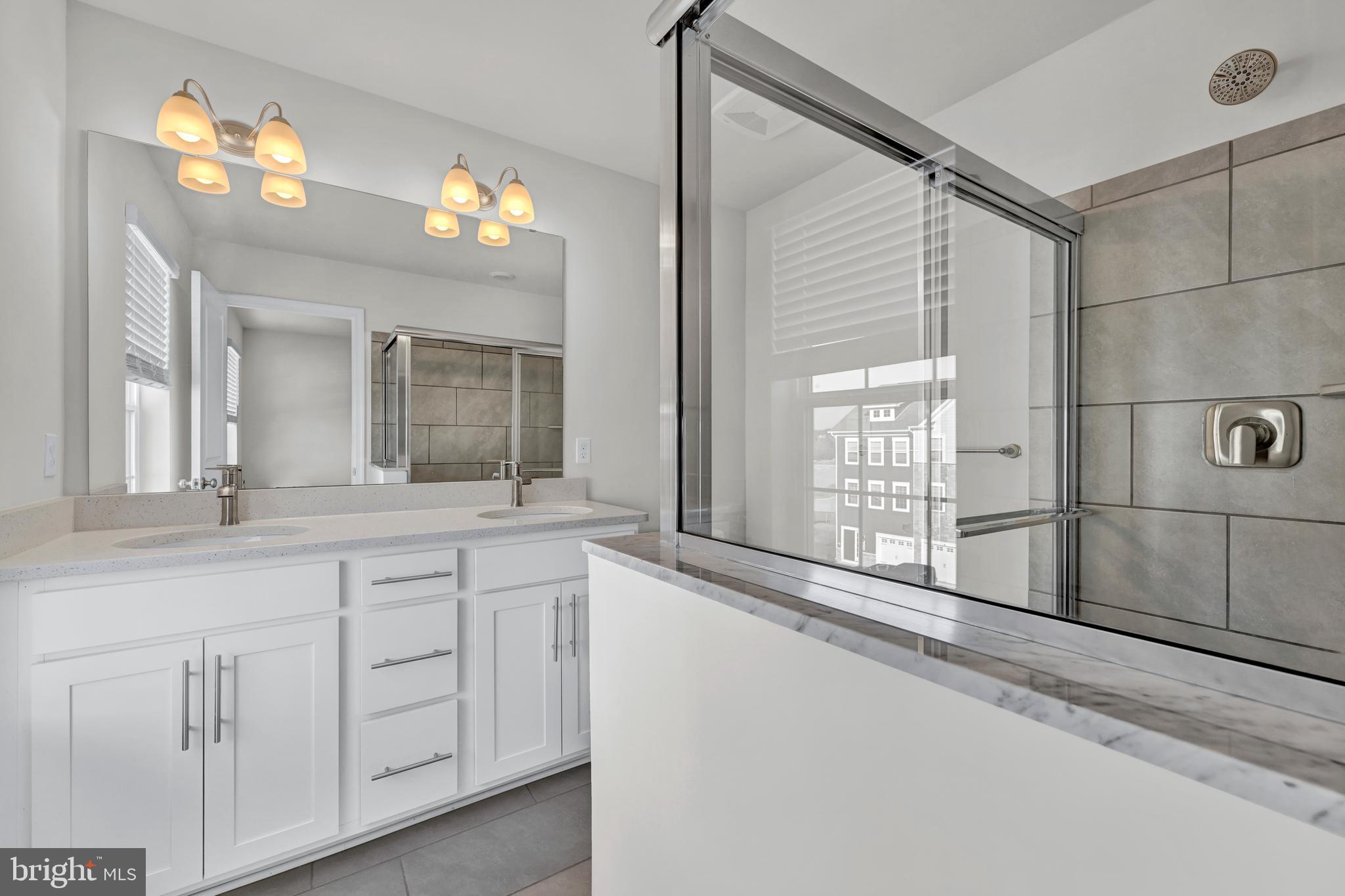5021 Silver Oak Drive Rosedale, MD 21237 - Photo 19 of 19 a bathroom with a sink and a large mirror