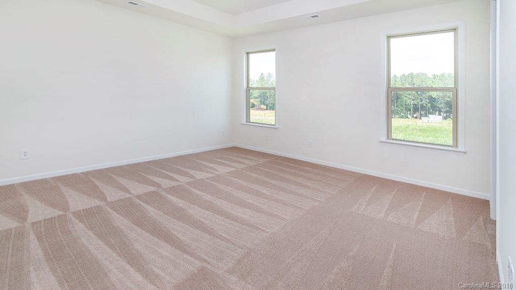 5549 Braddock Ml Way, Unit 264 Lancaster, SC 29720 - Photo 13 of 23 an empty room with windows