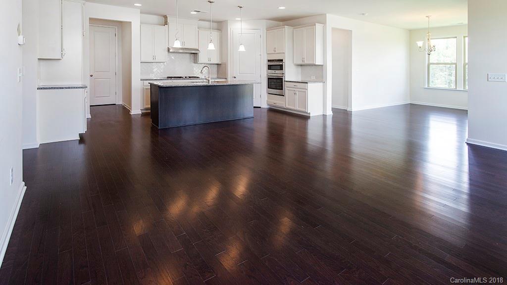 5549 Braddock Ml Way, Unit 264 Lancaster, SC 29720 - Photo 17 of 23 a view of kitchen with cabinets and wooden floor
