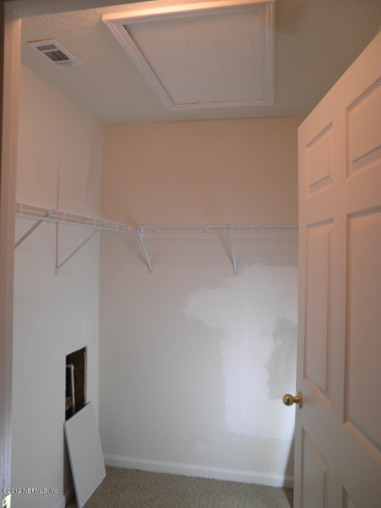7920 Merrill Road, Unit 912 Jacksonville, FL 32277 - Photo 12 of 14 a view of small space with closet