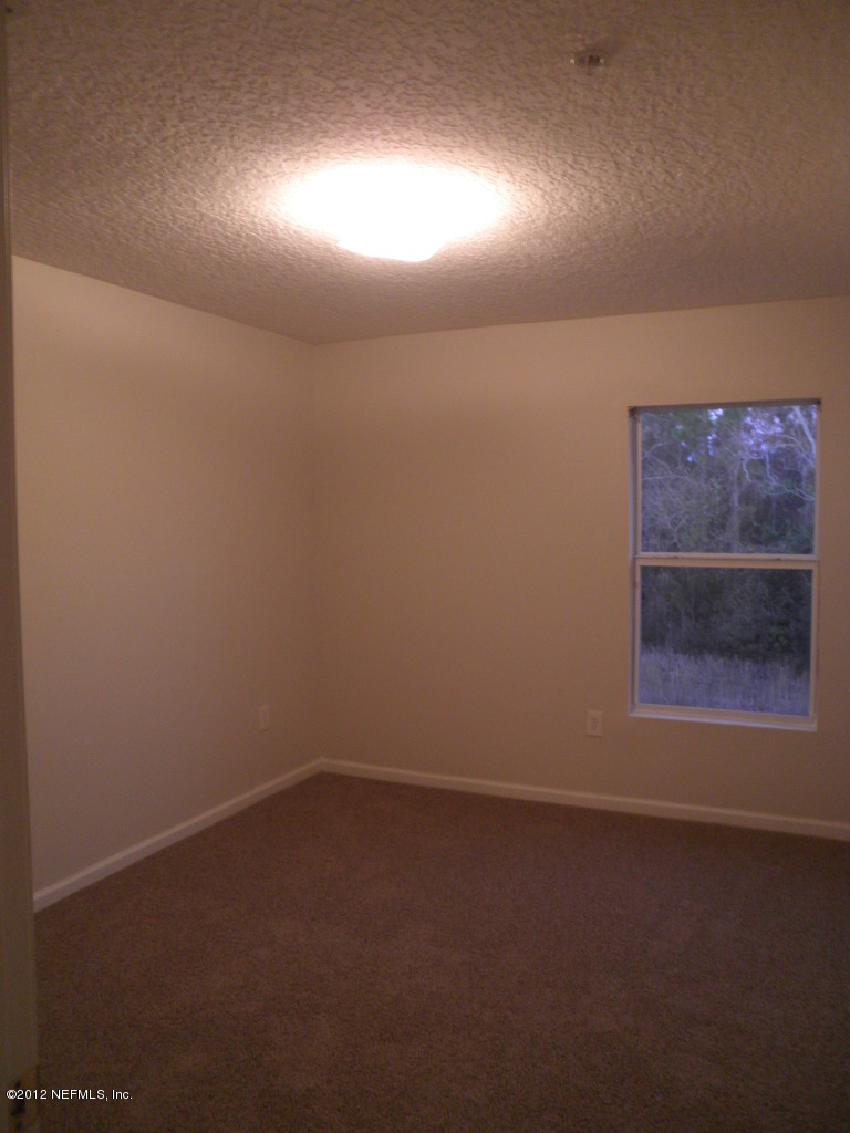 7920 Merrill Road, Unit 912 Jacksonville, FL 32277 - Photo 8 of 14 an empty room with a empty space