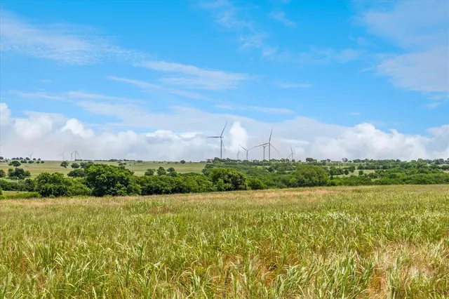 a view of a lake with houses in the back