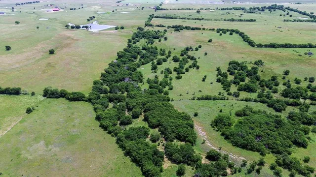 a view of a lake with a yard