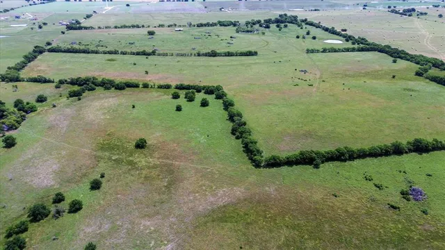 a view of a lake with a yard