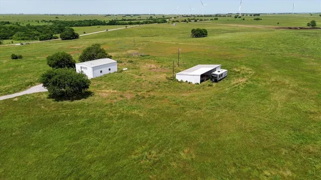 a floor to ceiling window and an ocean view