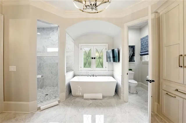 a view of staircase with railing and white walls