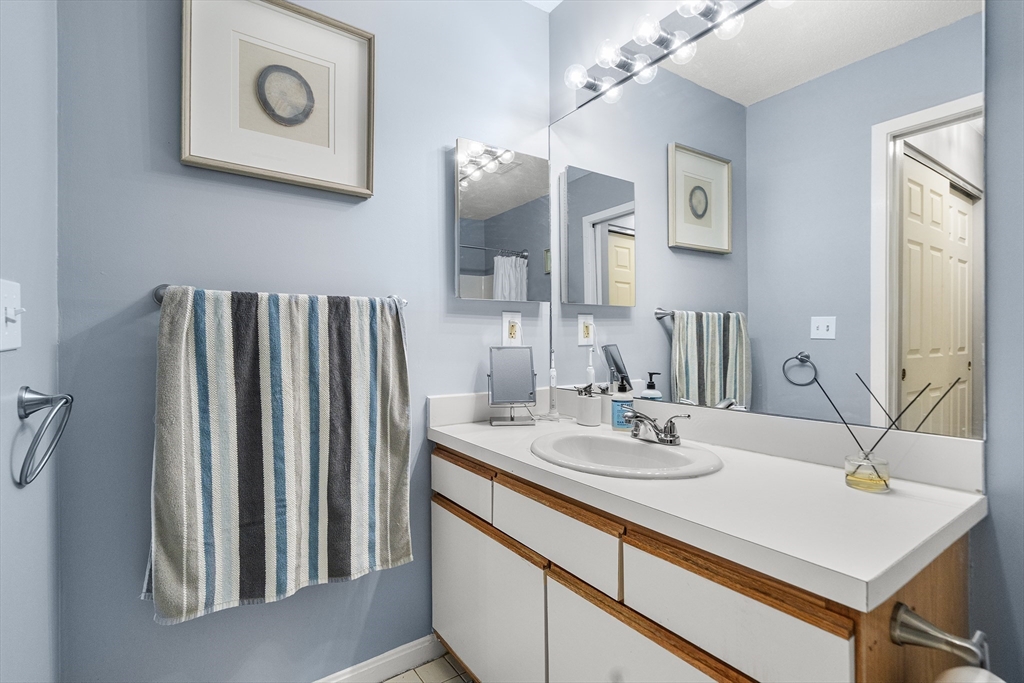 700 Shore Drive, Unit 810 Fall River, MA 02721 - Photo 15 of 22 a bathroom with a sink and a mirror