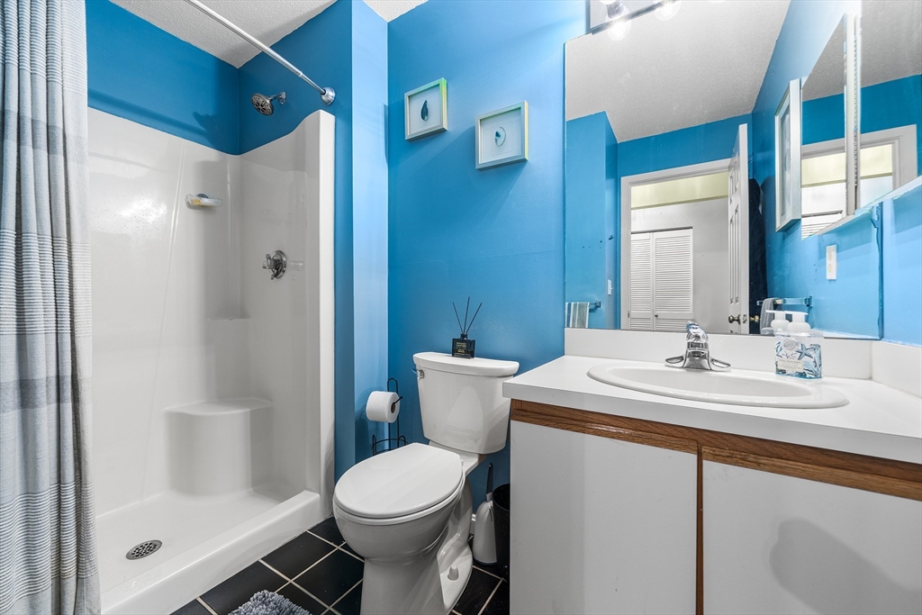 700 Shore Drive, Unit 810 Fall River, MA 02721 - Photo 19 of 22 a bathroom with a sink toilet and shower