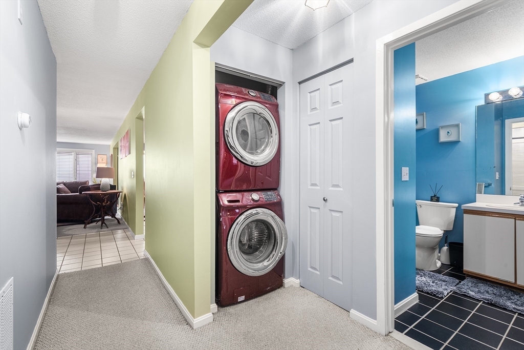 700 Shore Drive, Unit 810 Fall River, MA 02721 - Photo 20 of 22 a view of a bedroom with washer and dryer