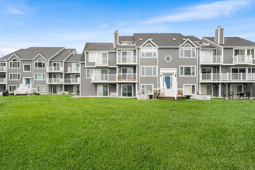 700 Shore Drive, Unit 810 Fall River, MA 02721 - Photo 21 of 22 a front view of a building with a garden