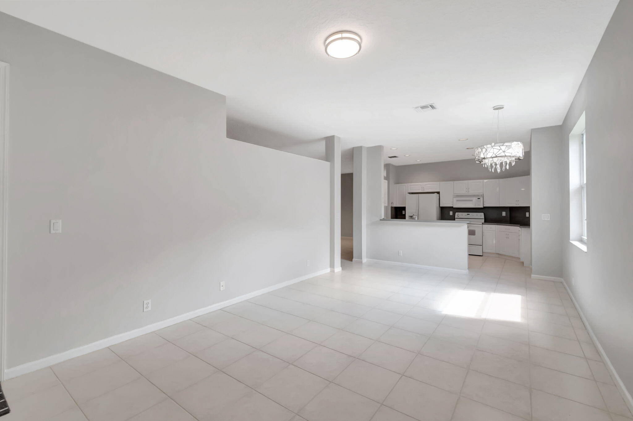 5916 Seashell Terrace Boynton Beach, FL 33437 - Photo 16 of 80 a view of a kitchen with furniture and a kitchen