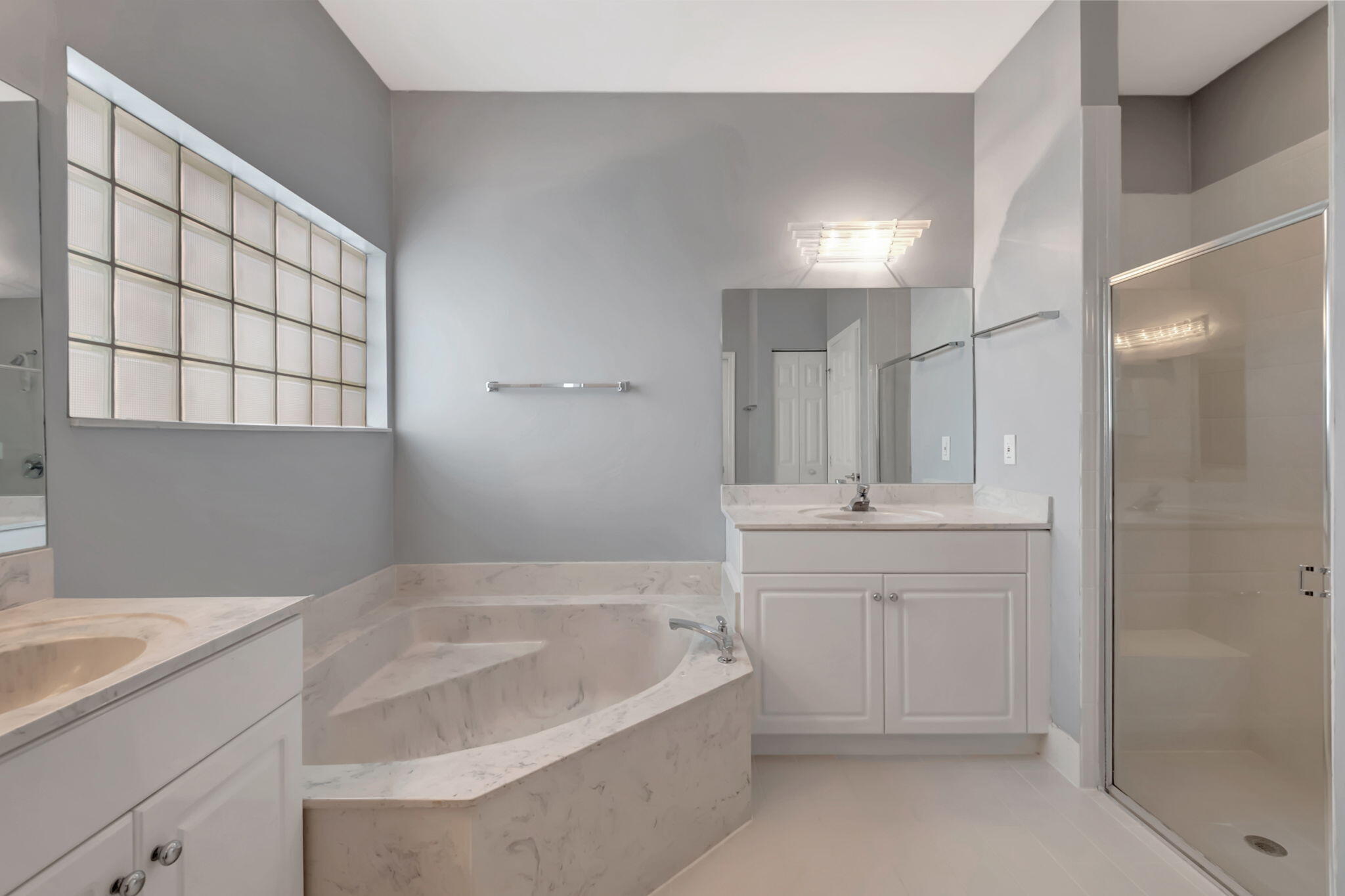 5916 Seashell Terrace Boynton Beach, FL 33437 - Photo 37 of 80 a bathroom with a bathtub and a sink