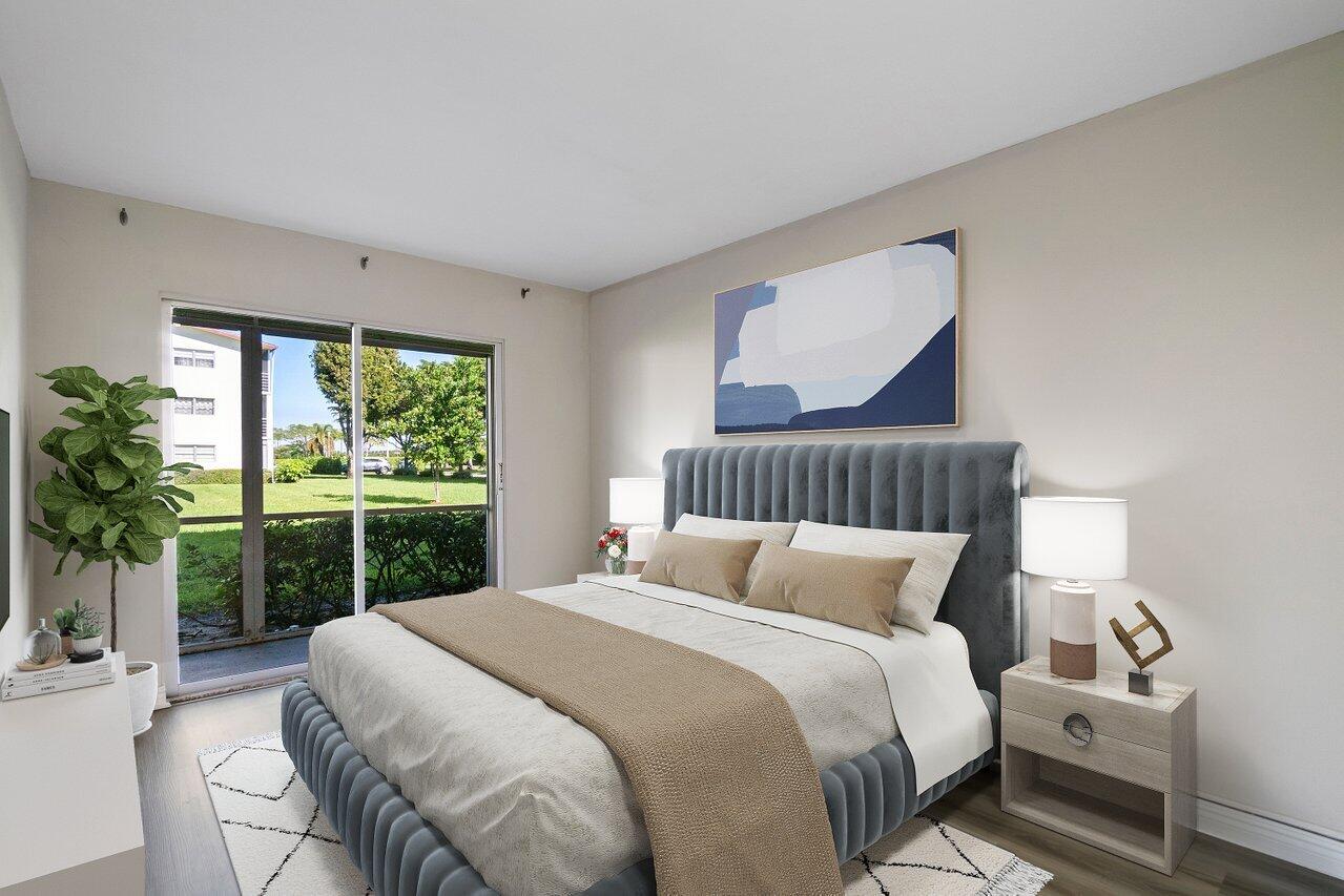 517 Fanshaw M Boca Raton, FL 33434 - Photo 17 of 28 a bedroom with a bed and a window