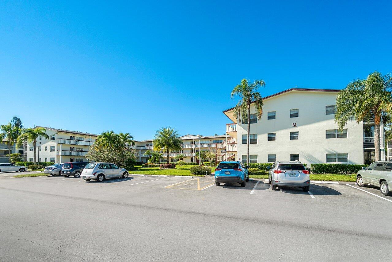 517 Fanshaw M Boca Raton, FL 33434 - Photo 2 of 28 a car parked in front of a building