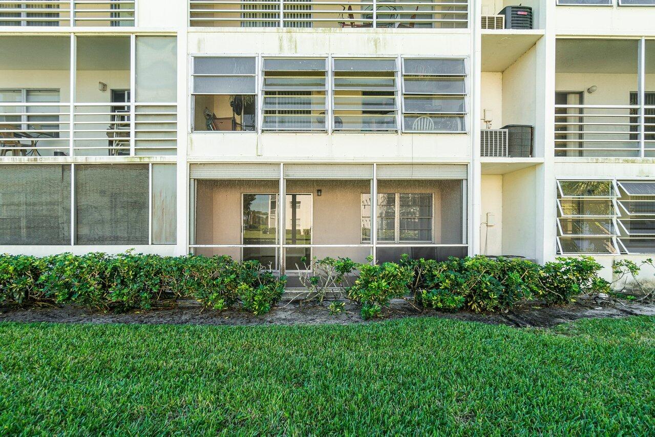 517 Fanshaw M Boca Raton, FL 33434 - Photo 25 of 28 a view of a house with a garden