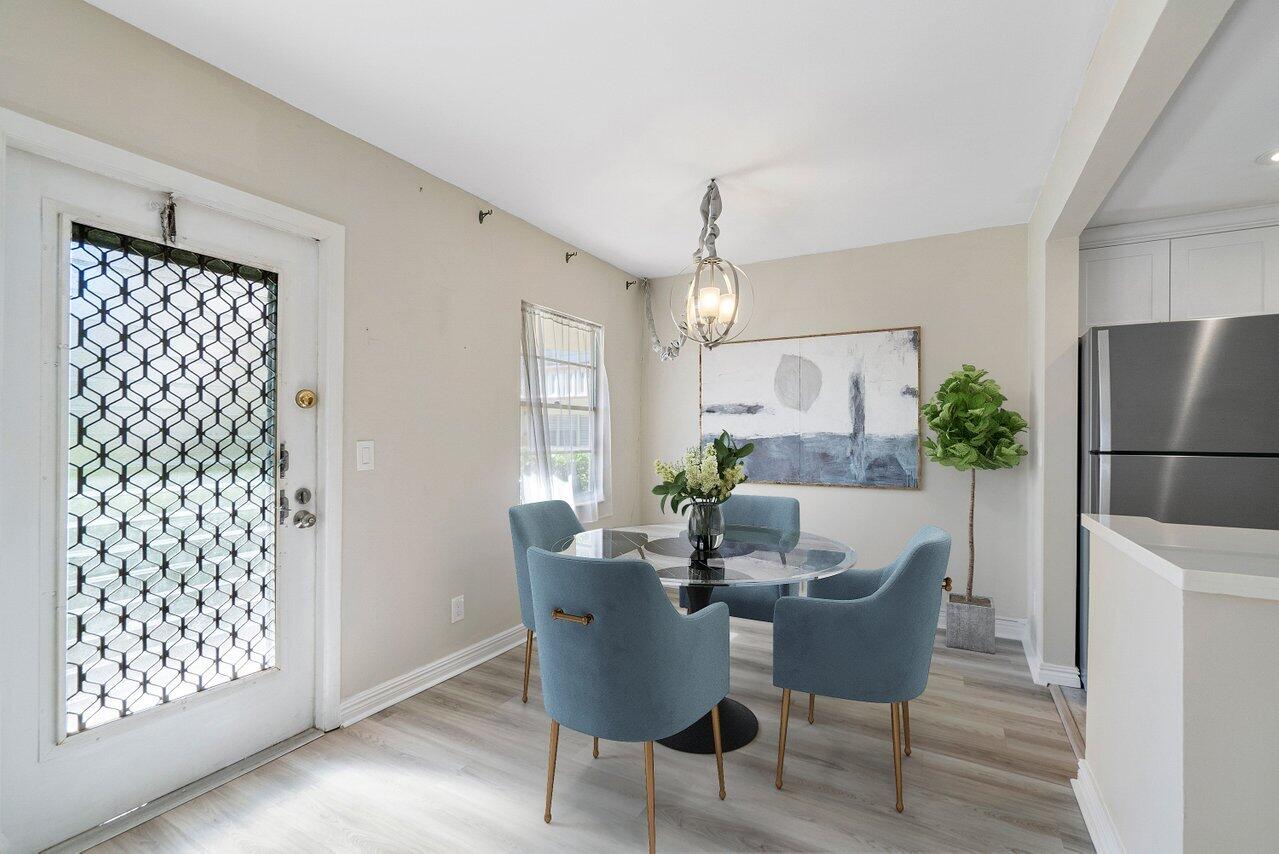 517 Fanshaw M Boca Raton, FL 33434 - Photo 8 of 28 a dining room with furniture and window