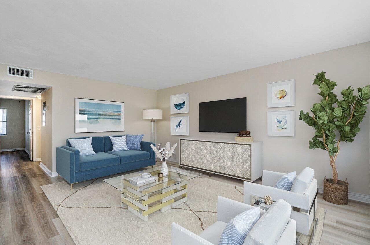 517 Fanshaw M Boca Raton, FL 33434 - Photo 10 of 28 a living room with furniture and a flat screen tv