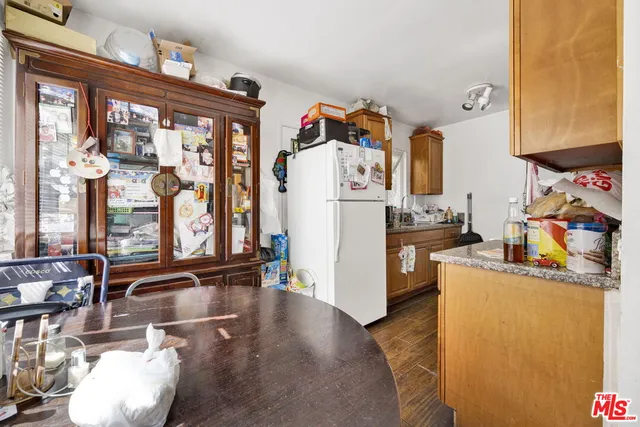 a kitchen with refrigerator and window