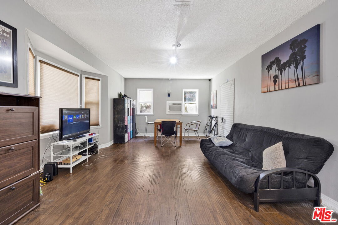 14539 Hart Street Van Nuys, CA 91405 - Photo 6 of 39 a living room with furniture and wooden floor