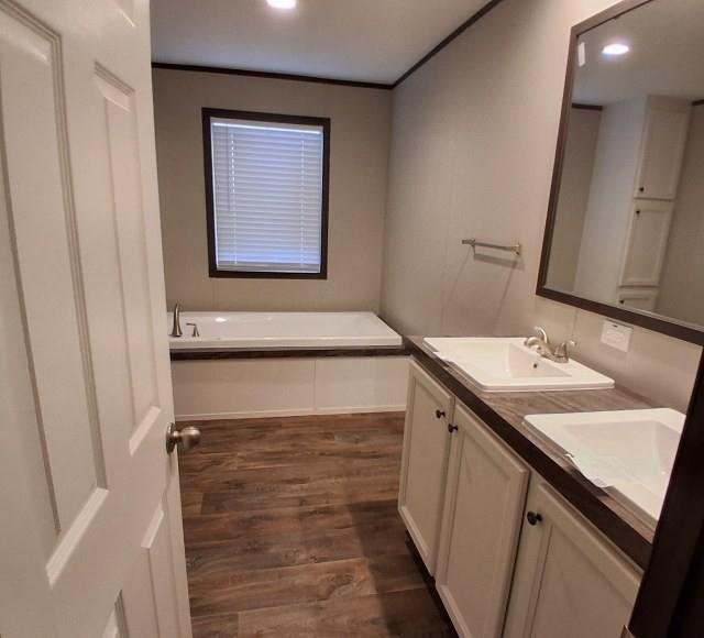 798 North 4190 Road Hugo, OK 74743 - Photo 12 of 16 a bathroom with a sink and a mirror