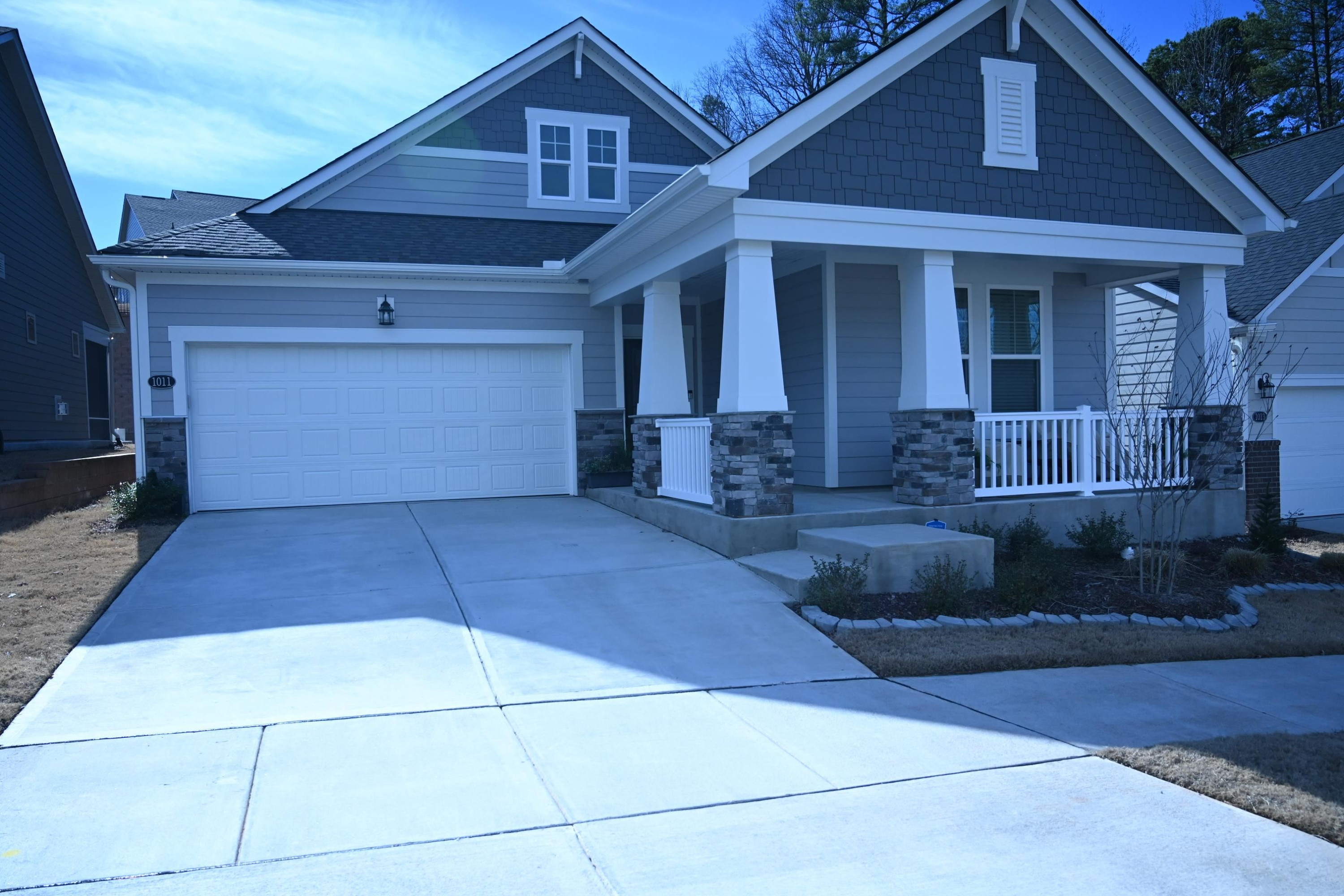 1011 Plath Drive Durham, NC 27703 - Photo 2 of 3 a front view of a house with a yard