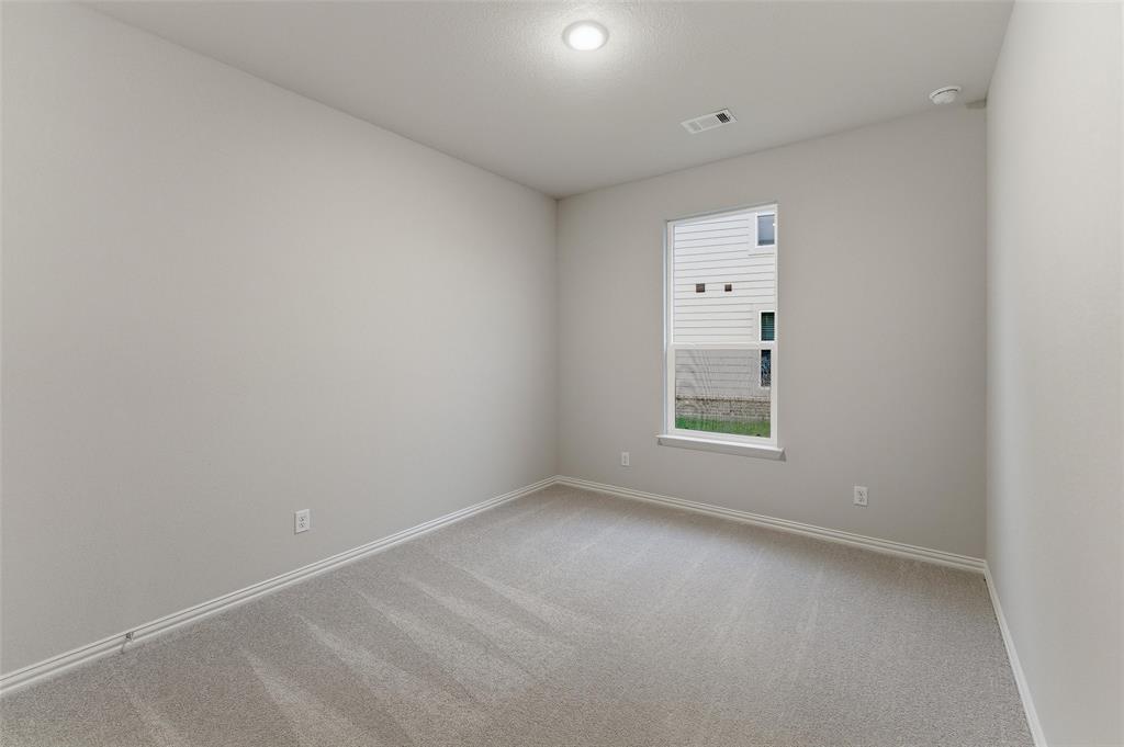 1237 Frio Drive Springtown, TX 76082 - Photo 14 of 25 Carpeted room with a single window, recessed lighting, and light-colored walls
