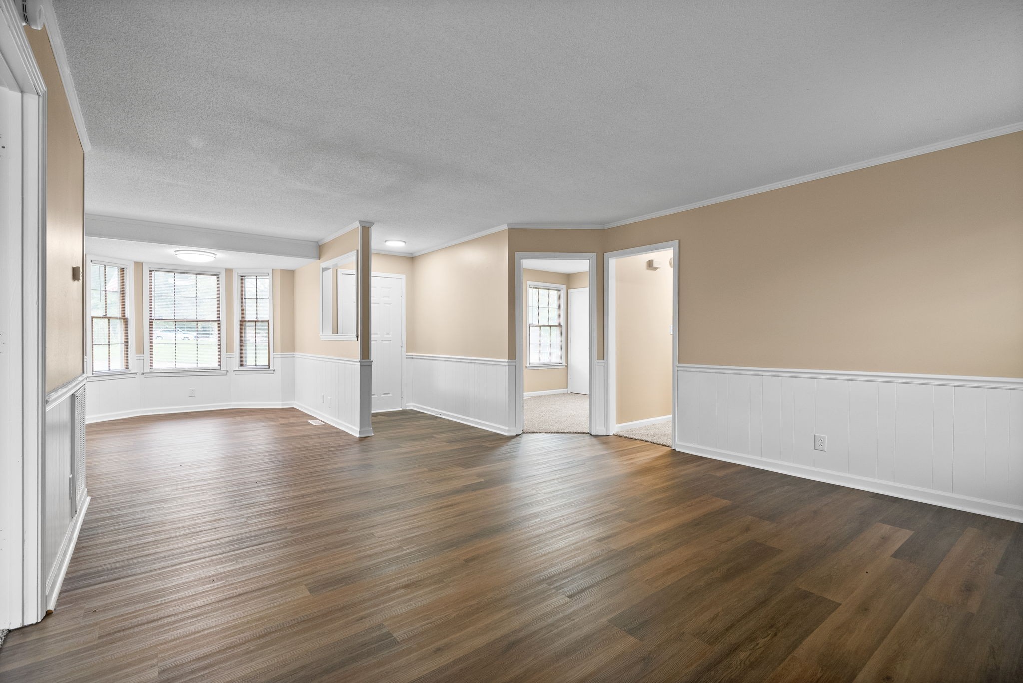 619 Ranch Hill Drive Clarksville, TN 37042 - Photo 11 of 32 a view of an empty room with window and wooden floor