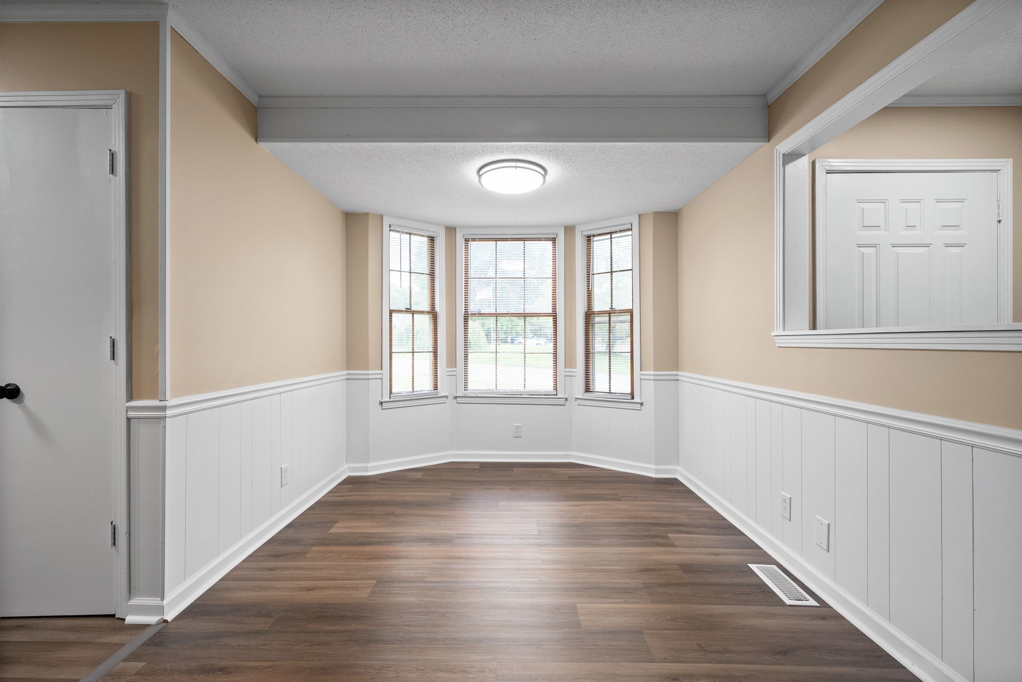 619 Ranch Hill Drive Clarksville, TN 37042 - Photo 13 of 32 a view of an empty room with wooden floor and a window