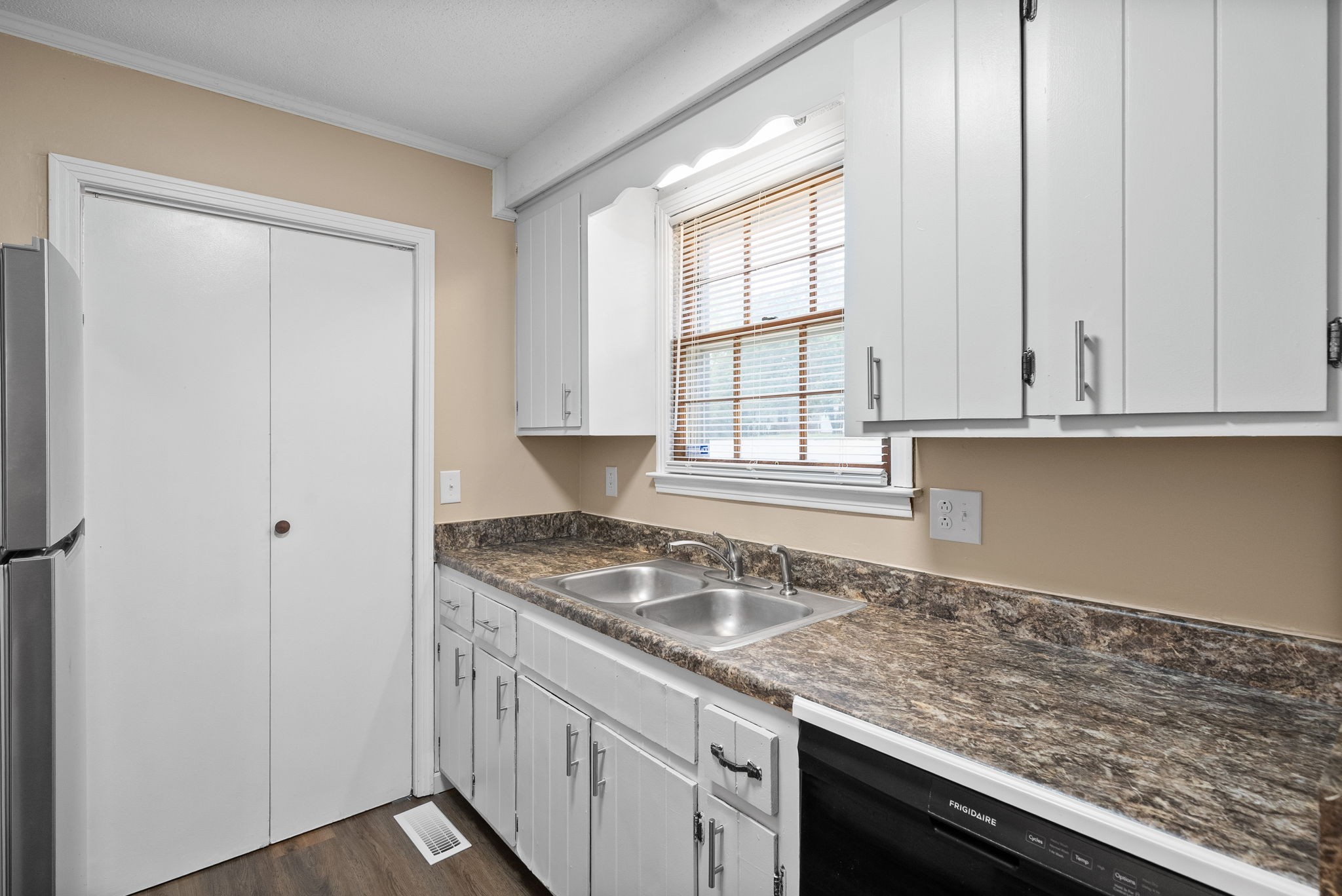 619 Ranch Hill Drive Clarksville, TN 37042 - Photo 15 of 32 a kitchen with granite countertop white cabinets and a sink