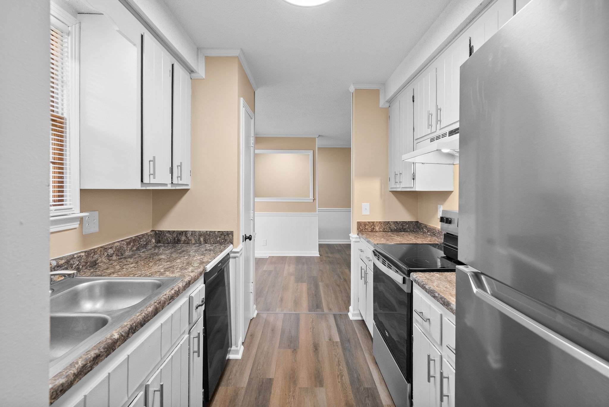 619 Ranch Hill Drive Clarksville, TN 37042 - Photo 16 of 32 a kitchen with granite countertop a sink stove and cabinets