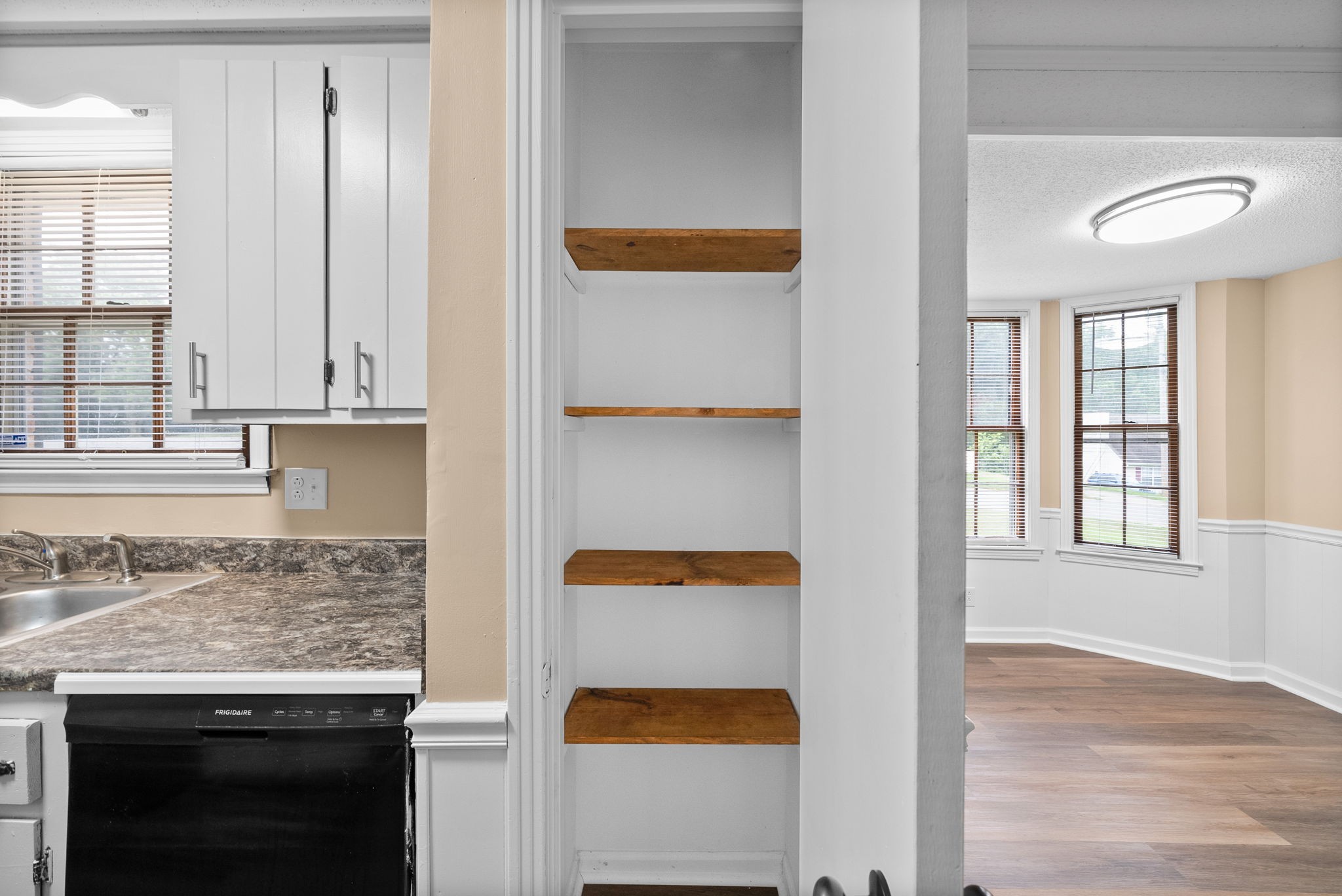 619 Ranch Hill Drive Clarksville, TN 37042 - Photo 17 of 32 a view of kitchen with wooden floor and window
