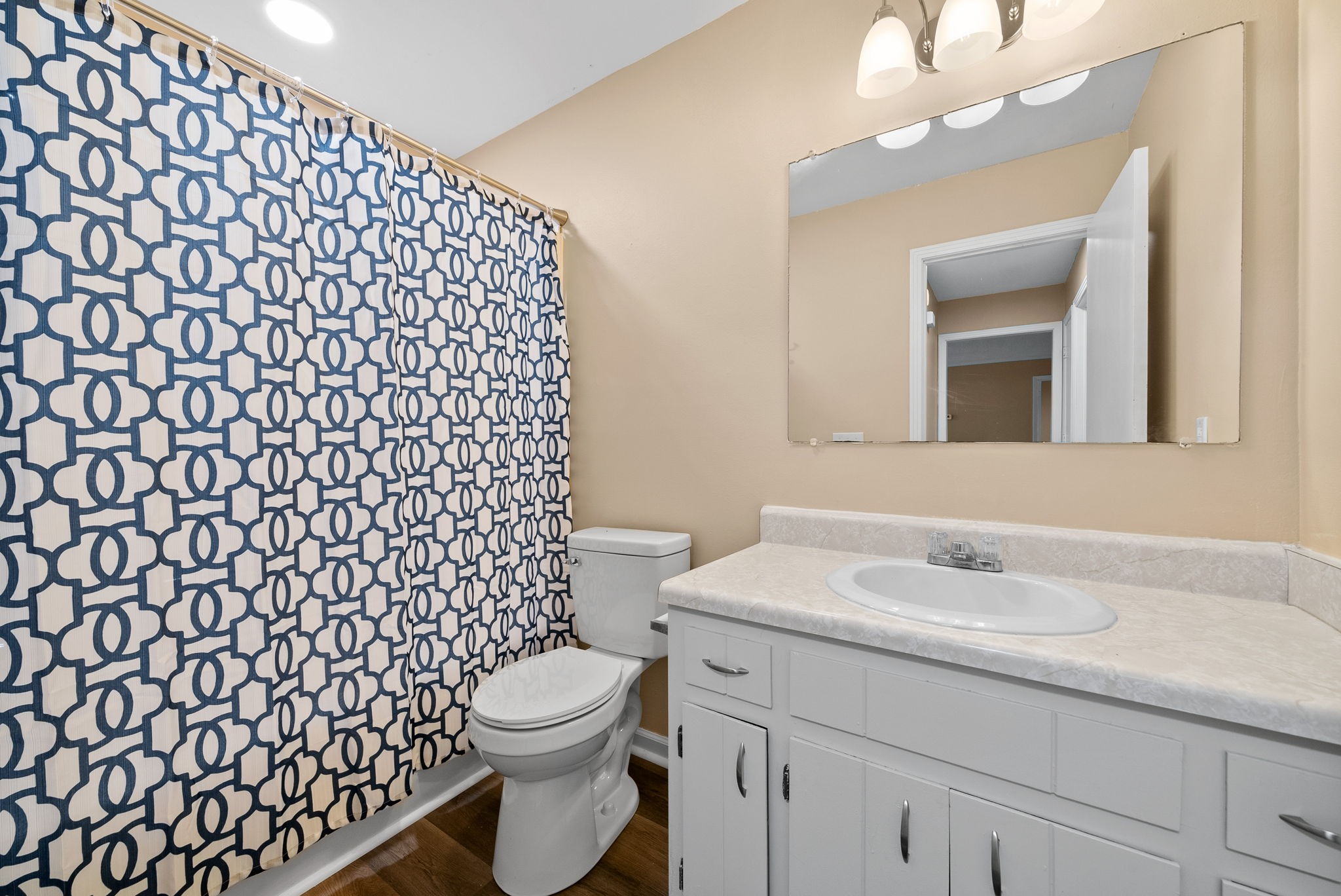 619 Ranch Hill Drive Clarksville, TN 37042 - Photo 26 of 32 a bathroom with a sink a toilet and a mirror