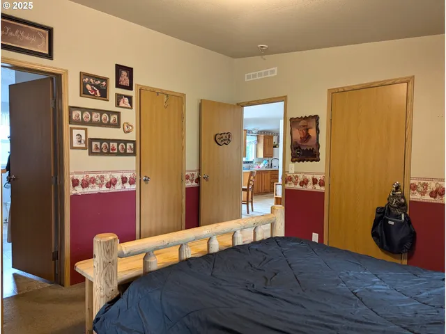 a view of a room with furniture and wooden floor