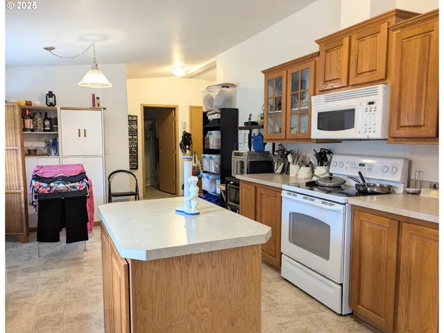 a kitchen that has a lot of cabinets in it