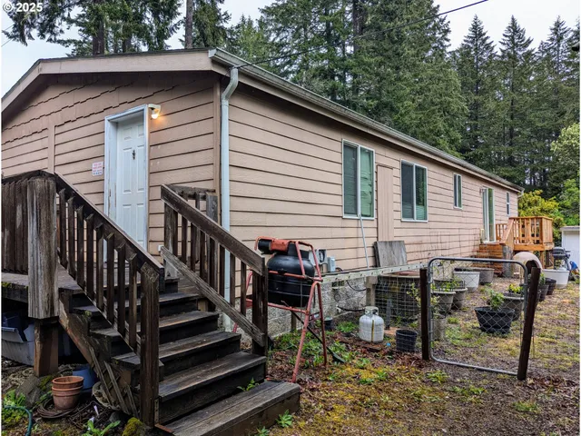 a view of a two chairs and table in the balcony
