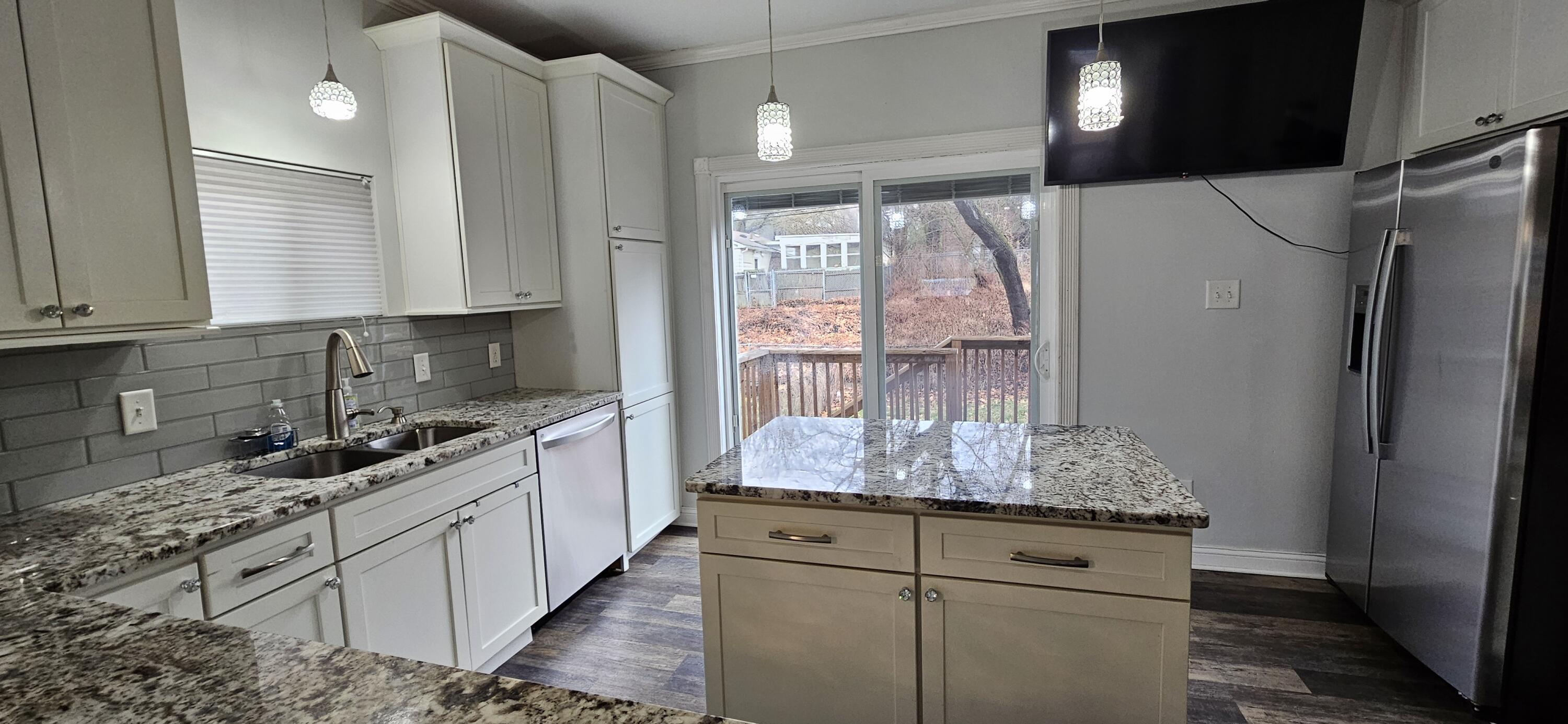 7419 Maple Avenue Gary, IN 46403 - Photo 16 of 93 a kitchen with stainless steel appliances granite countertop a sink stove and refrigerator