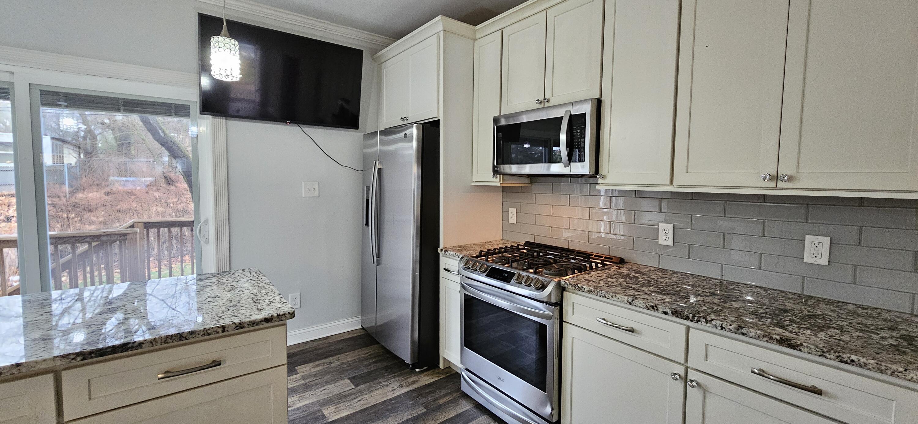 7419 Maple Avenue Gary, IN 46403 - Photo 17 of 93 a kitchen with granite countertop cabinets stainless steel appliances and a counter space